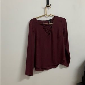 Loose burgundy/plum blouse with cage chest